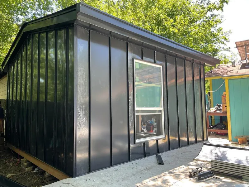 Black standing seam metal wall panels for Roof Inspection in Forest Hills