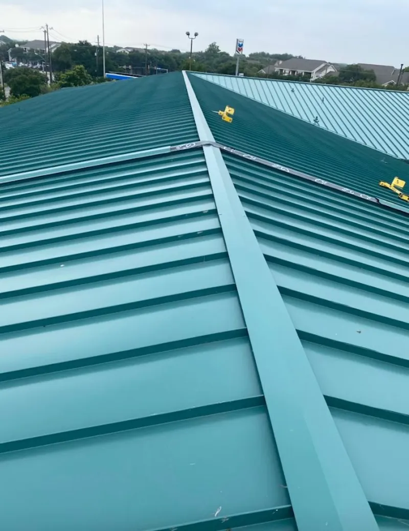 Green commercial metal roof ridge and valley for Metal Roof Repair in Forest Hills